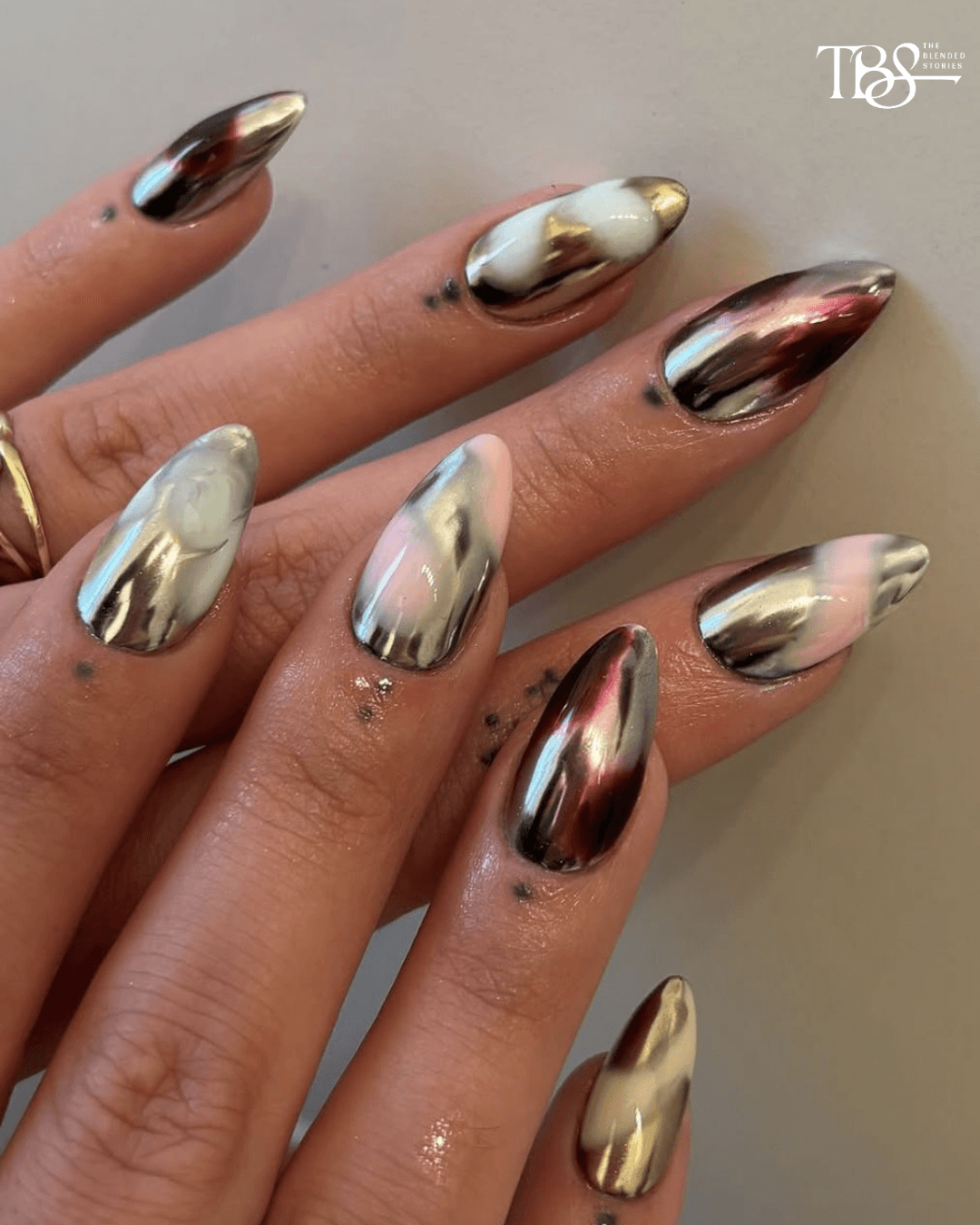 METALLIC NAILS - When subtle isn’t the brief. Molten silver, liquid gold and mirror-like finishes make the manicure the jewellery.